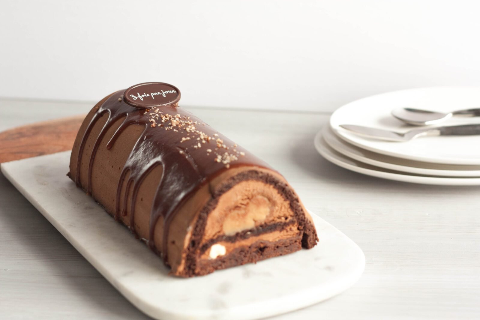 Chocolate log cake on a serving plate
