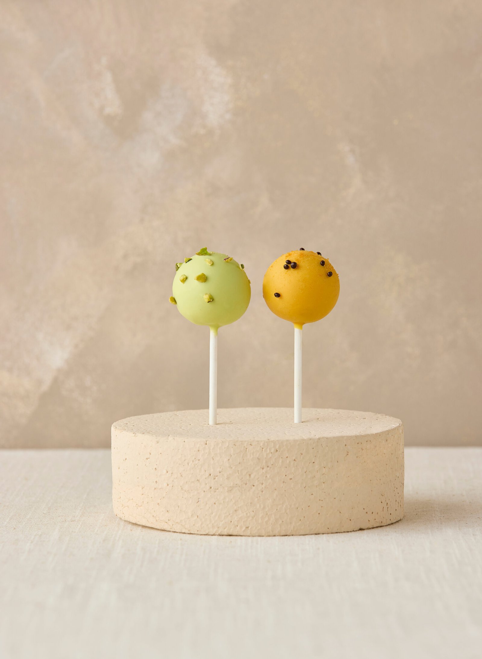 Cake pops on a round cake