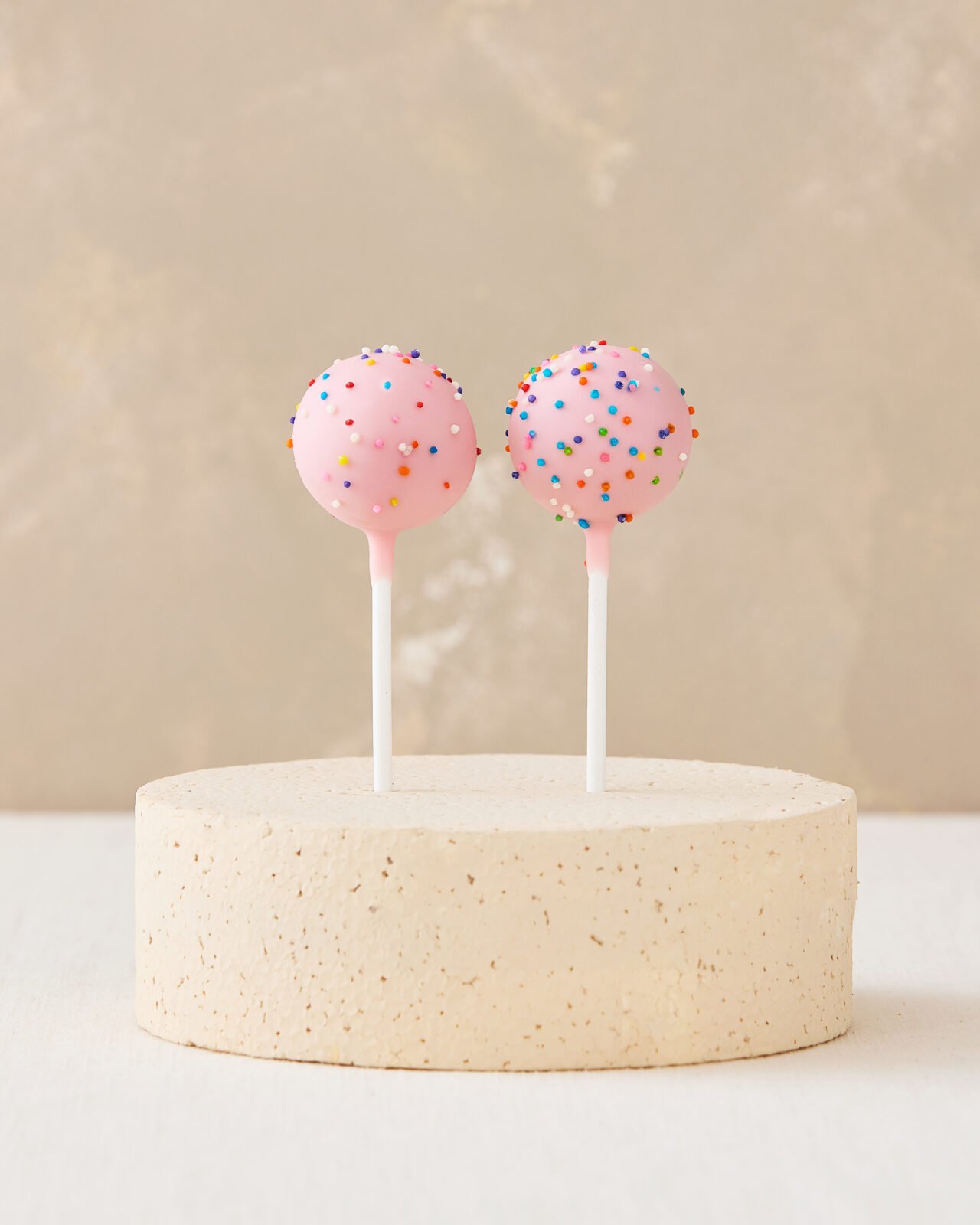 Cake pops on a round cake